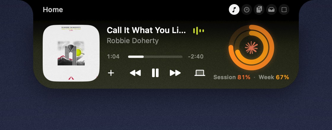 The Home space open, with the music player and usage ring tinted in colors from the album art